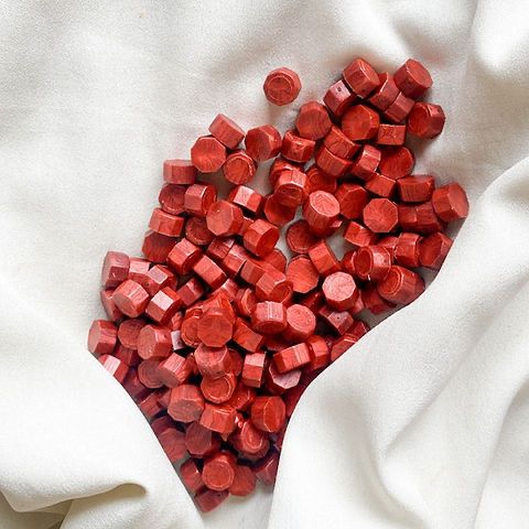 Red waxbeads